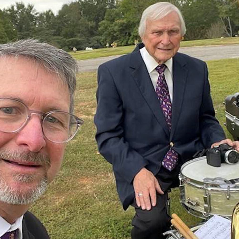 Son, David Simpkins on the tuba and father, Buddy Simpkins on drums at the graveside service of Sylacauga businessman Jim Clinton. Alabama News