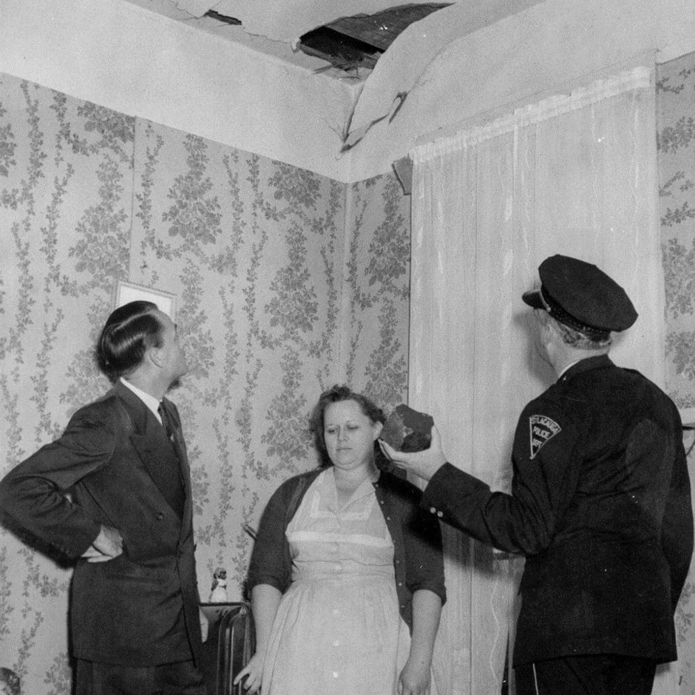 Ann Hodges showing the meteorite and the hole it punched in her roof to long-time Sylacauga Mayor Ed Howard and Police Chief W.D. Ashcraft. Alabama News