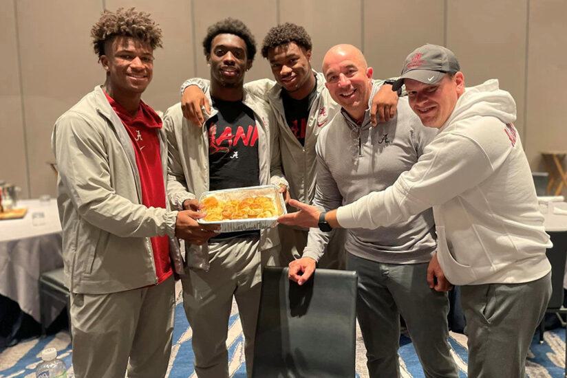 Bama players and staff serving Waysider biscuits in Pasadena. Photo: Waysider