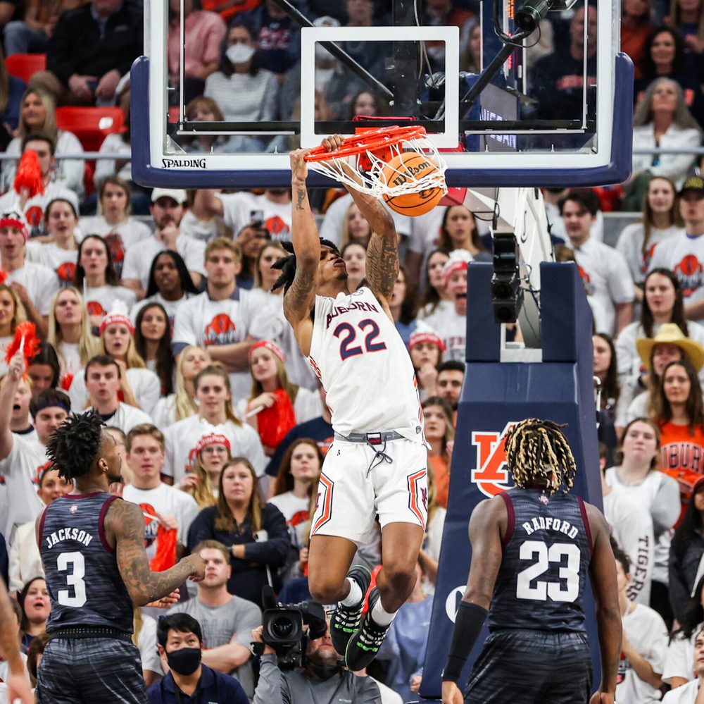 Feb 12, 2022; Auburn, AL, USA; Allen Flanigan (22) dunks the ball during the game between Auburn and Texas A&M at Auburn Arena. Mandatory Credit: Jacob Taylor/AU Athletics Alabama News