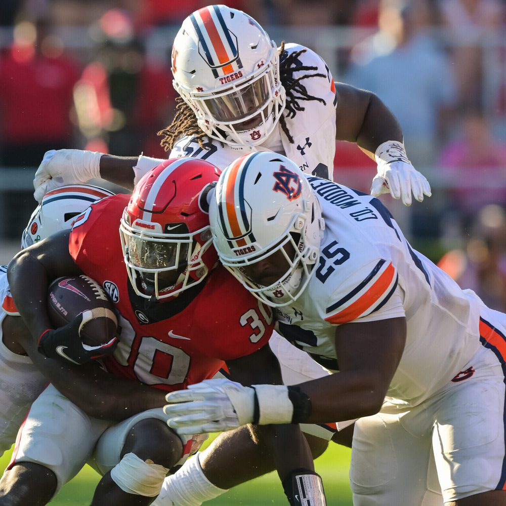 Athens, GA, USA; Colby Wooden (25) tackles Georgia offense during the game between Auburn and Georgia at Sanford Stadium. Alabama News