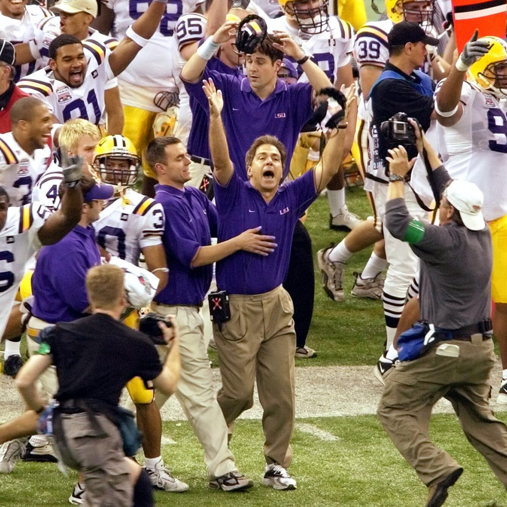 Louisiana State University coach Nick Saban, second from right foreground, raises his arms as he is celebrates LSU's 21-14 victory over Oklahoma in the Sugar Bowl at the Louisiana Superdome in New Orleans, Sunday Jan, 4, 2004. (AP Photo/Andrew Cohoon) Alabama News