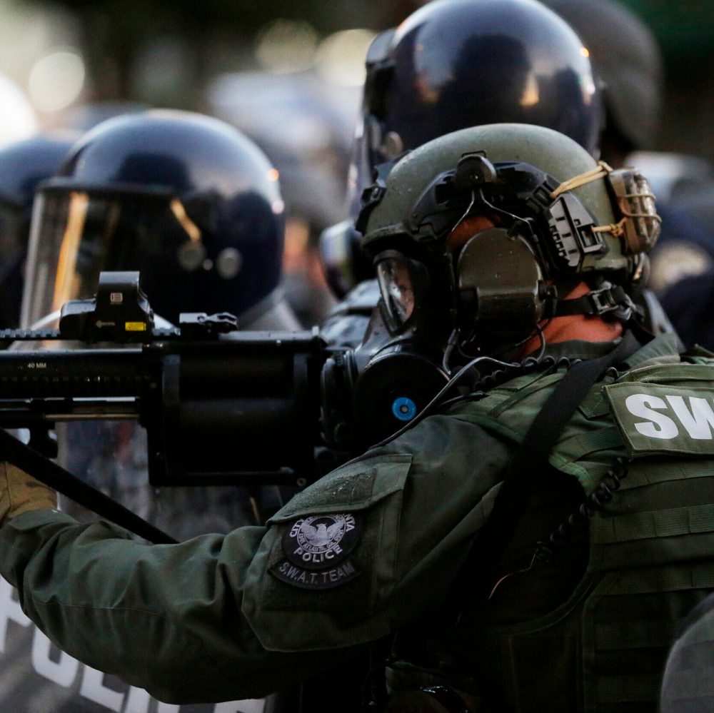 Police prepare to shoot gas as demonstrators march, Sunday, May 31, 2020, in Atlanta Alabama News