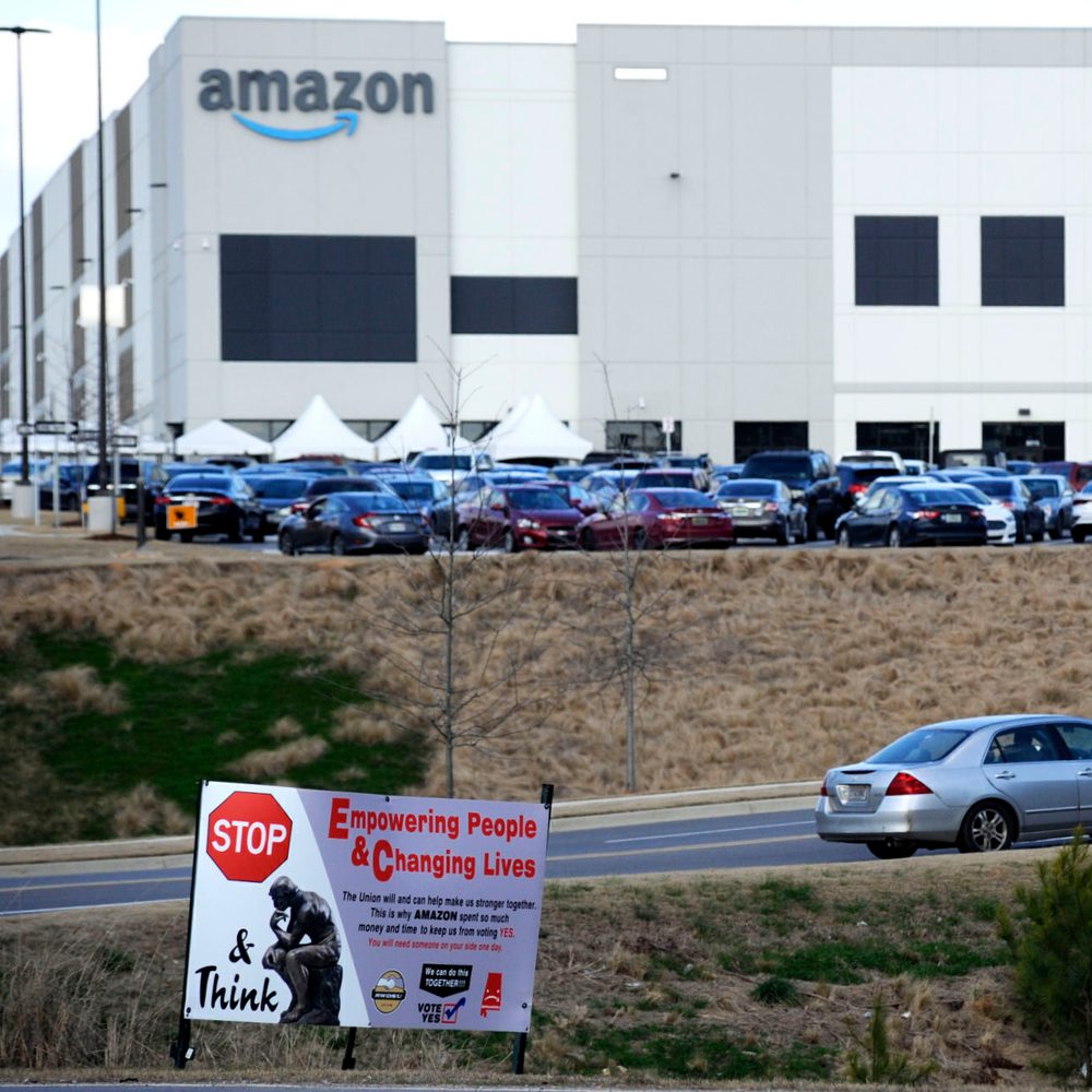 FILE- This Feb. 9, 2021 photo file photo, a car enters an Amazon facility where labor is trying to organize workers in Bessemer, Ala. Organizers are pushing for some 6,000 Amazon workers to join the Retail, Wholesale and Department Store Union on the prom Alabama News