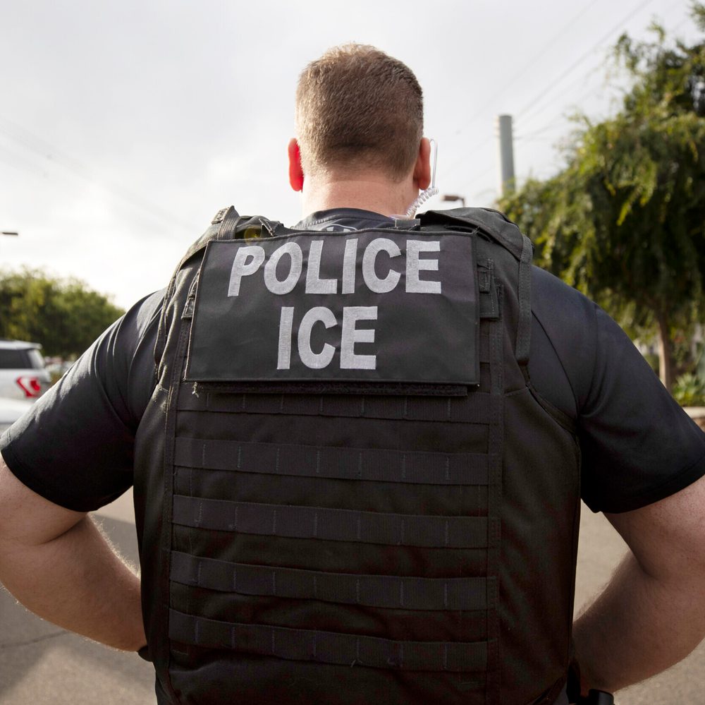 A U.S. Immigration and Customs Enforcement (ICE) officer looks on during an operation in Escondido, Calif., July 8, 2019. Immigration enforcement arrests in the interior of the U.S. fell over the past year as the Biden administration shifted its enforceme Alabama News