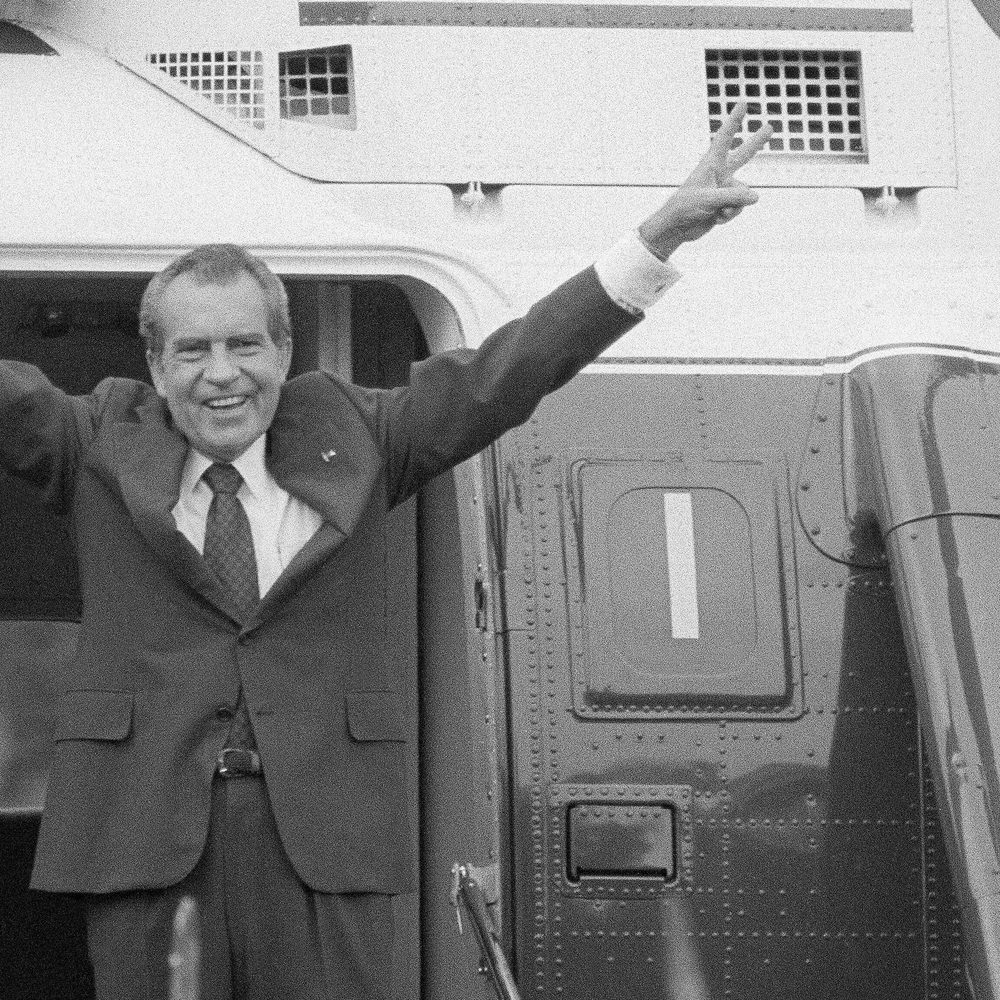 Richard Nixon says goodbye with a victorious salute to his staff members outside the White House as he boards a helicopter after resigning the presidency on Aug. 9, 1974. Alabama News