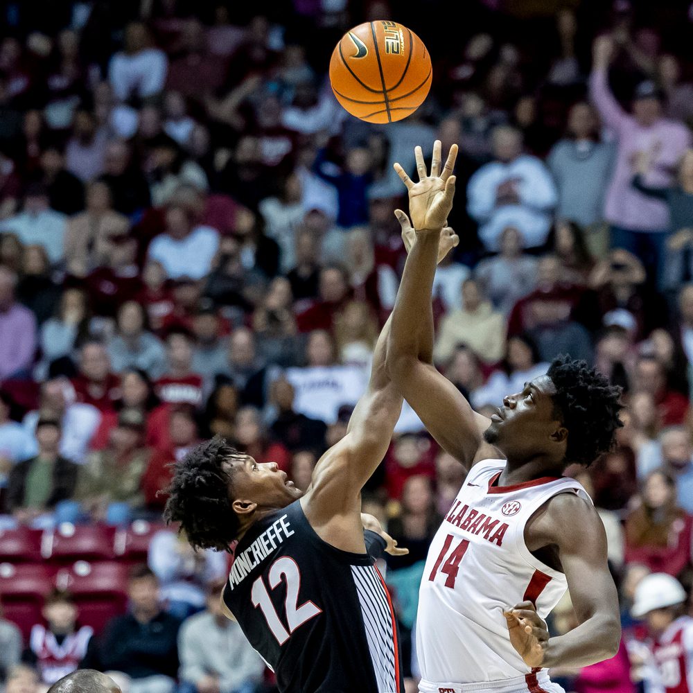 Alabama center Charles Bediako (14) gets the tip over Georgia forward Matthew-Alexander Moncrieffe (12) during the first half of an NCAA college basketball game, Saturday, Feb. 18, 2023, in Tuscaloosa, Ala. (AP Photo/Vasha Hunt) Alabama News