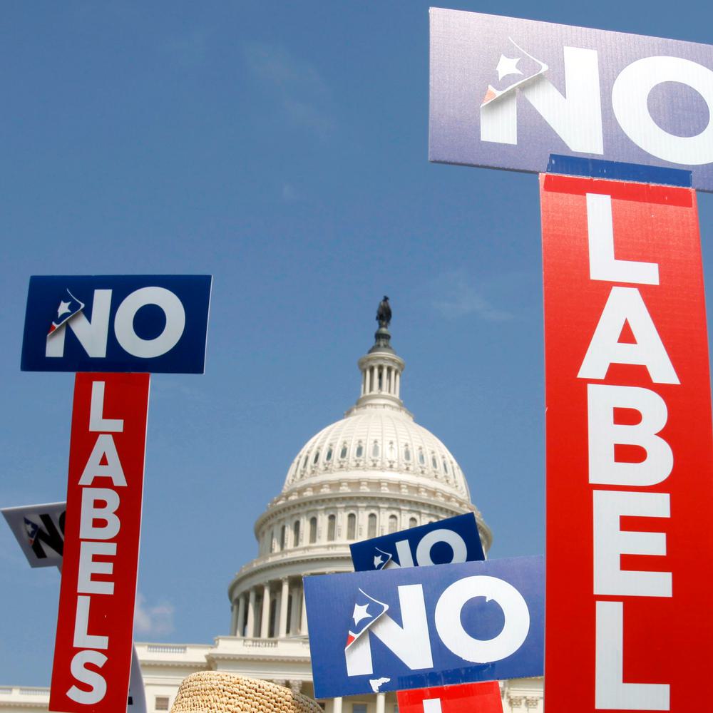People with the group No Labels hold signs during a rally on Capitol Hill in Washington, July 18, 2011. Alabama News