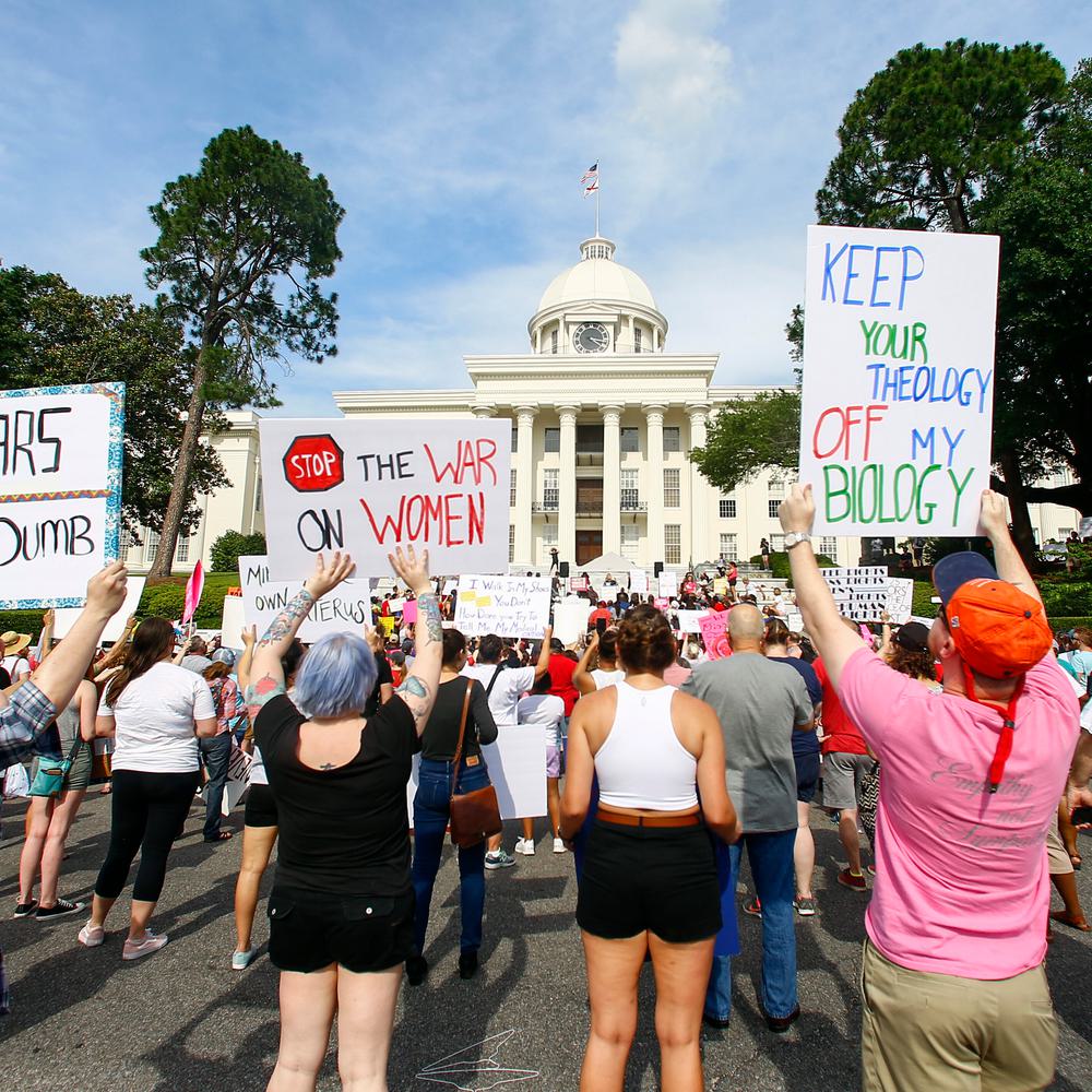 Protesters for women's rights hold a rally on the Alabama Capitol steps to protest a law passed the week before making abortion a felony in nearly all cases with no exceptions for cases of rape or incest, Sunday, May 19, 2019, in Montgomery, Ala. Alabama News