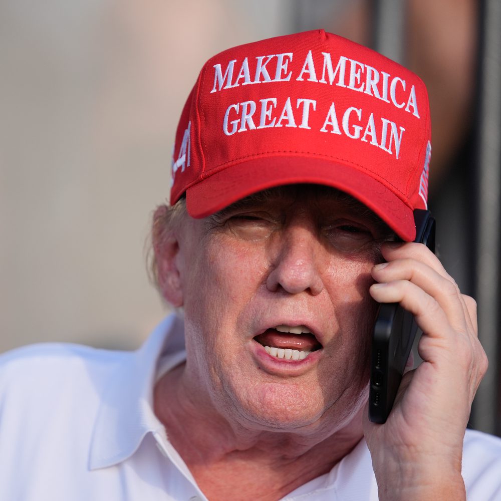 Republican presidential candidate, former President Donald Trump speaks on the phone as he watches play in the final round of LIV Golf Miami, at Trump National Doral Golf Club, Sunday, April 7, 2024, in Doral, Fla. (AP Photo/Rebecca Blackwell) Alabama News