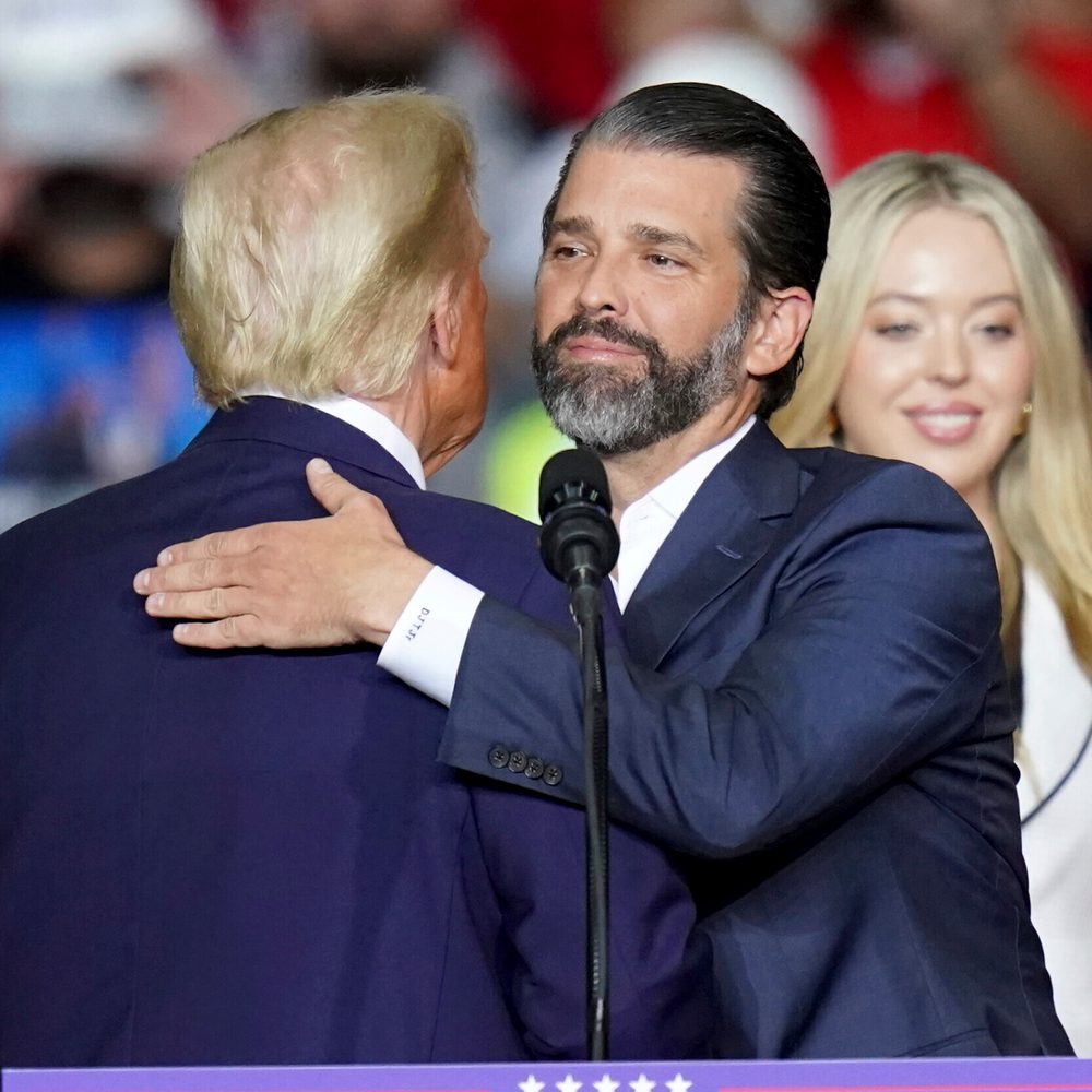 Republican presidential nominee former President Donald Trump hugs his son, Donald Trump Jr., as he speaks at a campaign rally at PPG Paints Arena, Monday, Nov. 4, 2024, in Pittsburgh. (AP Photo/Matt Freed) Alabama News