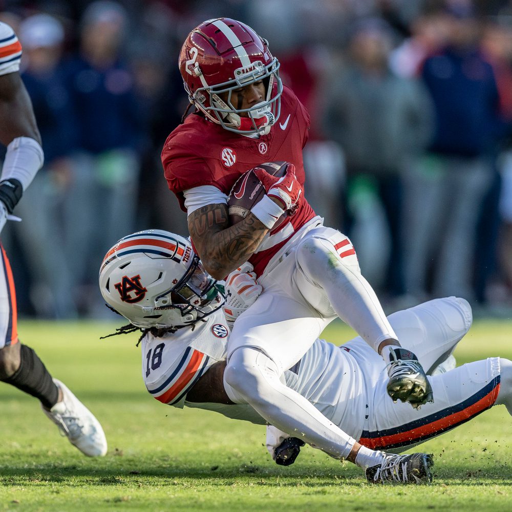 Alabama wide receiver Ryan Williams (2) is tackled by Auburn safety Kaleb Harris (18) during the first half of an NCAA college football game, Saturday, Nov. 30, 2024, in Tuscaloosa, Ala. (AP Photo/Vasha Hunt) Alabama News