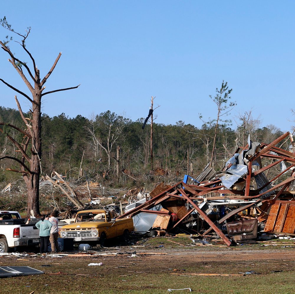 Residents look for personal belongings in the damage after a tornado passed through where two people lost their lives, Sunday, March 16, 2025, in Plantersville, Ala. (AP Photo/Butch Dill) Alabama News