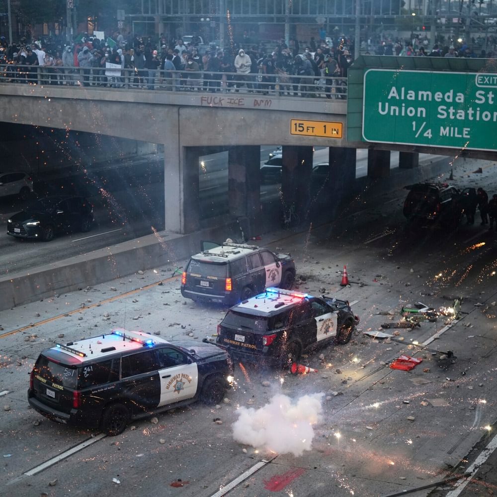 EDS NOTE: OBSCENITY A flash bomb explodes on the 101 Freeway near the metropolitan detention center of downtown Los Angeles, Sunday, June 8, 2025, following last night's immigration raid protest. (AP Photo/Eric Thayer) Alabama News