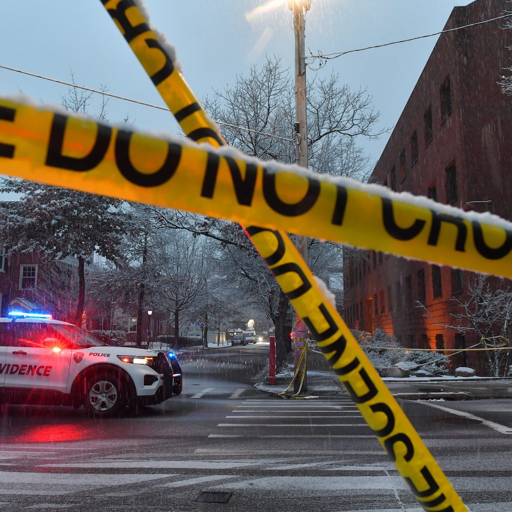 A police vehicle is parked at an intersection near crime scene tape at Brown University, Sunday, Dec. 14, 2025, in Providence, R.I., following a Saturday shooting at the university. (AP Photo/Steven Senne) Alabama News
