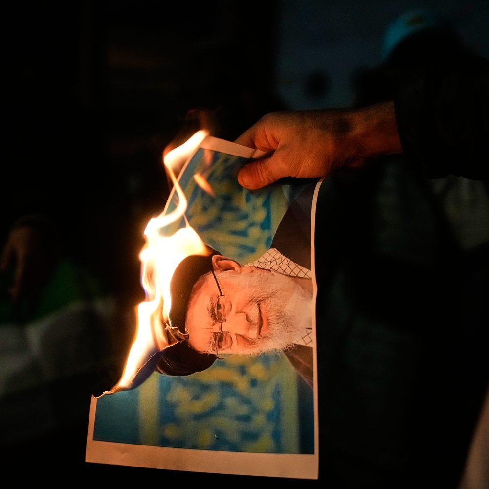 Demonstrators burn a poster depicting Iran's Supreme Leader Ayatollah Ali Khamenei during a rally in support of anti-government protests in Iran, in Holon, Israel Wednesday, Jan. 14, 2026. (AP Photo/Ohad Zwigenberg) Alabama News