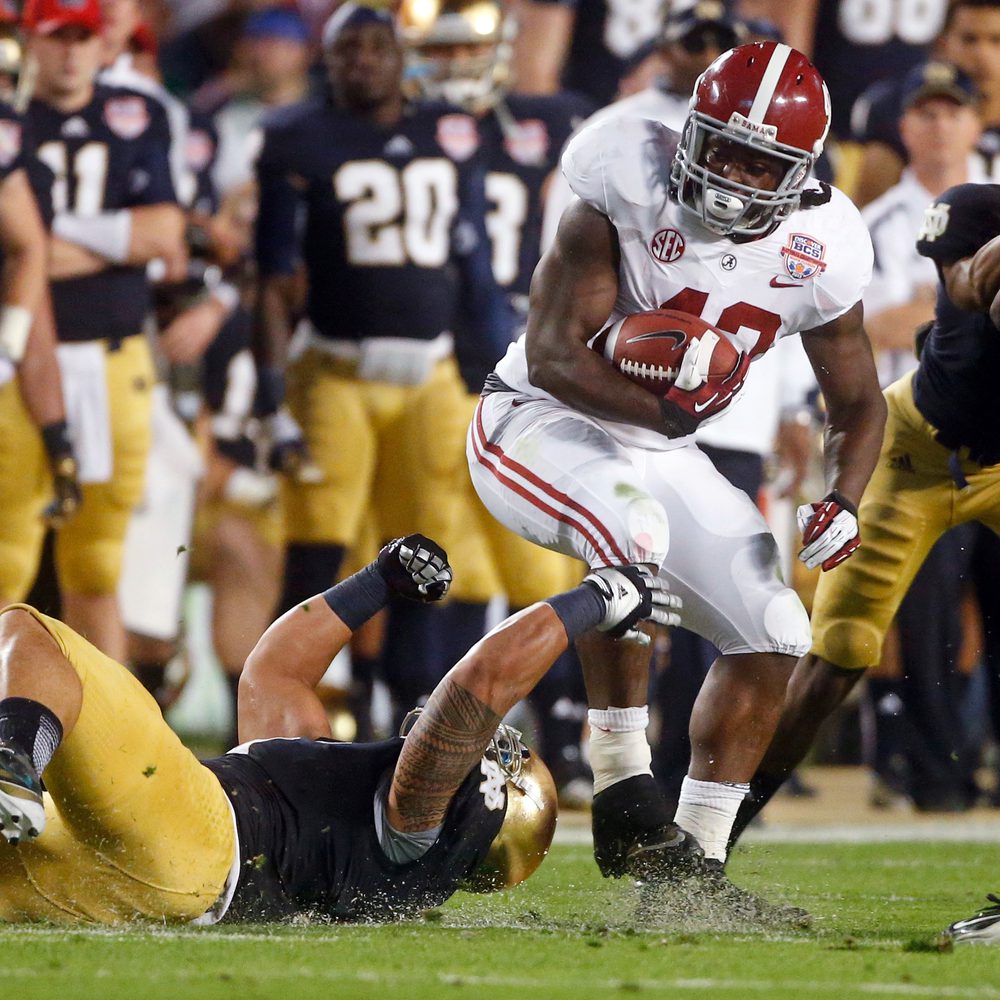 Alabama's Eddie Lacy tries to get past Notre Dame's Manti Te'o during the first half of the BCS National Championship college football game Monday, Jan. 7, 2013, in Miami. Alabama News