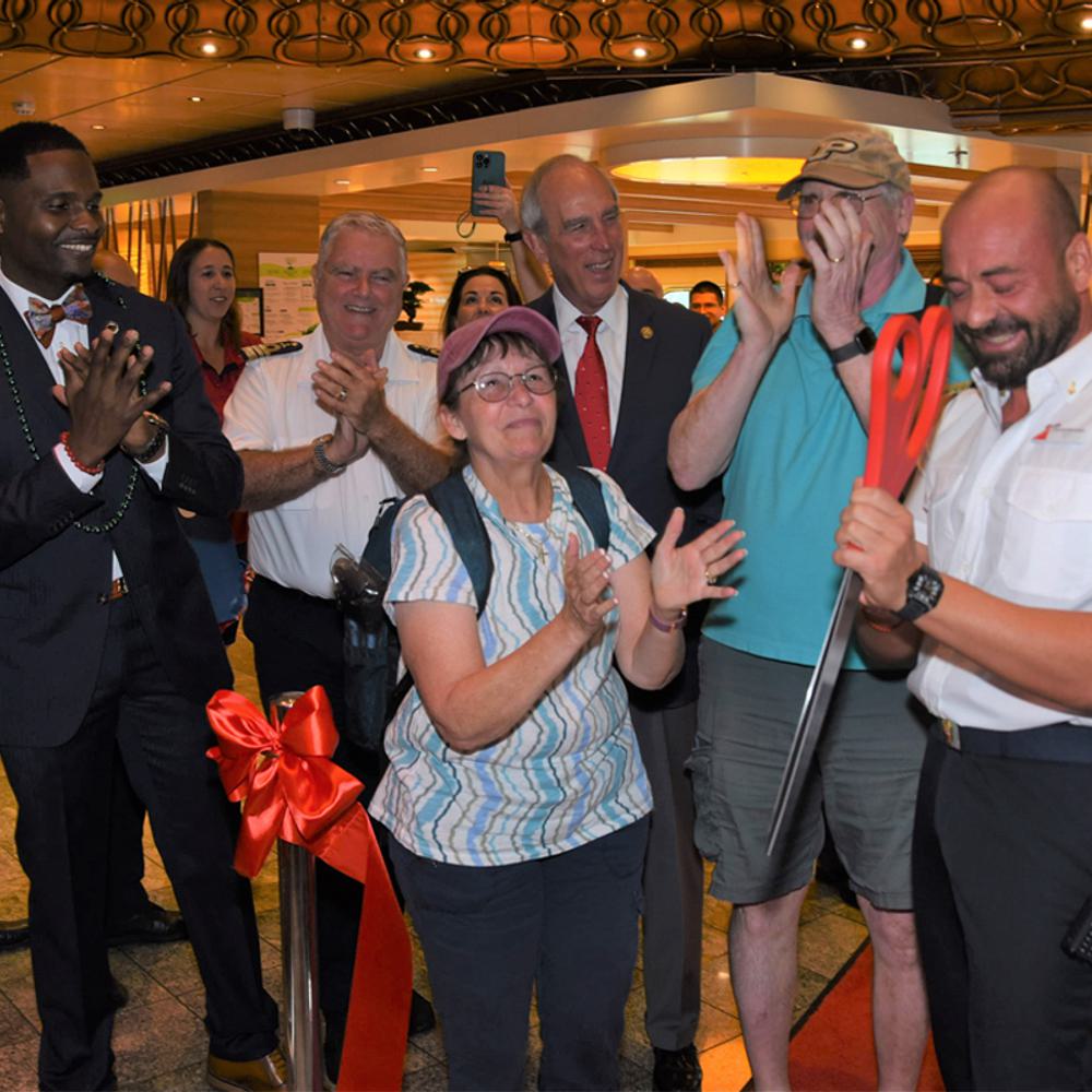 Mobiles first guests to board Carnival Spirit cut a ceremonial ribbon with Captain Salvatore Siviero Mobile Mayor Sandy Stimpson and Sarah Beth Reno Carnivals SVP of guest operations Alabama News