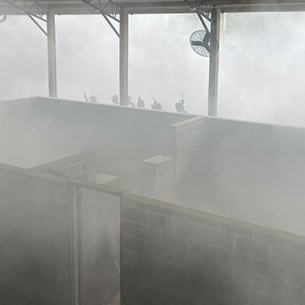 Smoke fills up the training facility as trainees approach to conduct an active shooter simulation Alabama News