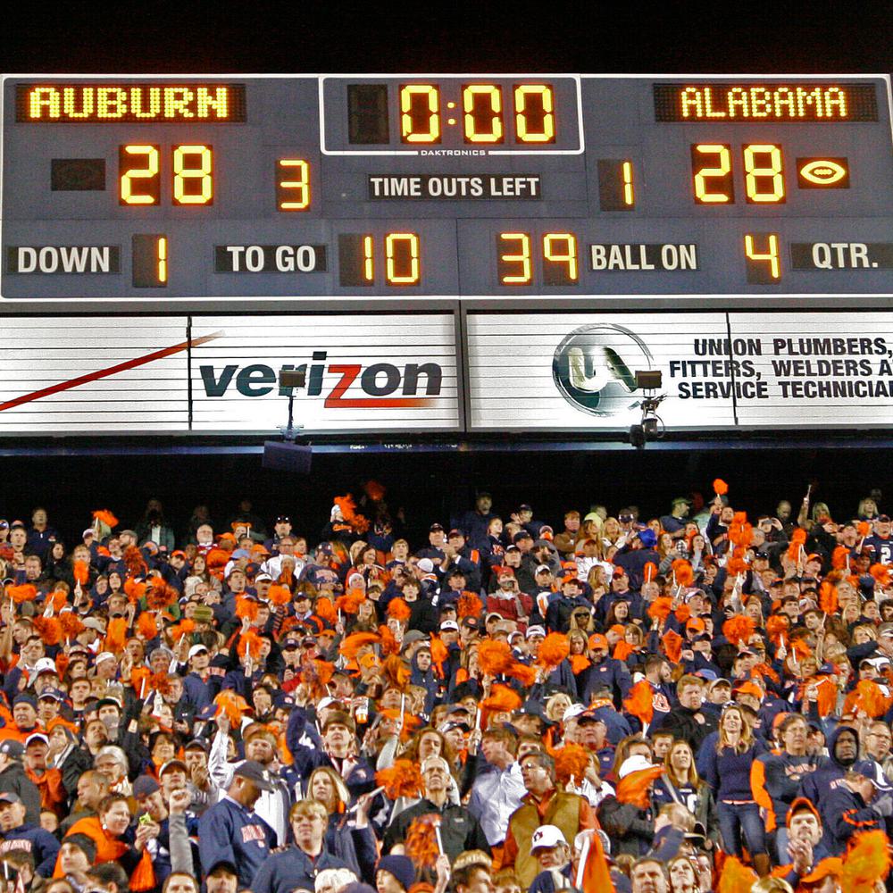 Auburn fans react at the end of a win over Alabama during the second half of an NCAA college football game in Auburn, Ala., Saturday, Nov. 30, 2013. Auburn beat Alabama 34-28. Alabama News
