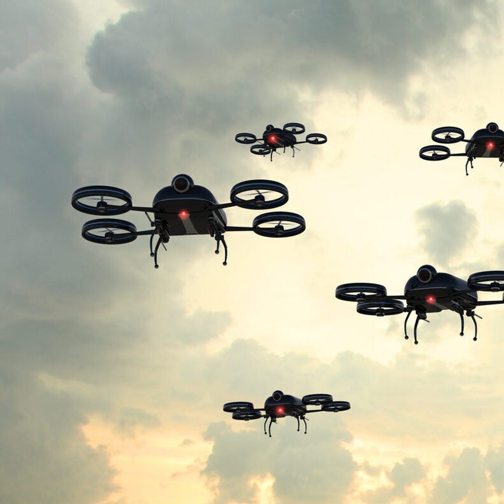 Drone invasion: black flying objects crowd the sky stock photo Alabama News