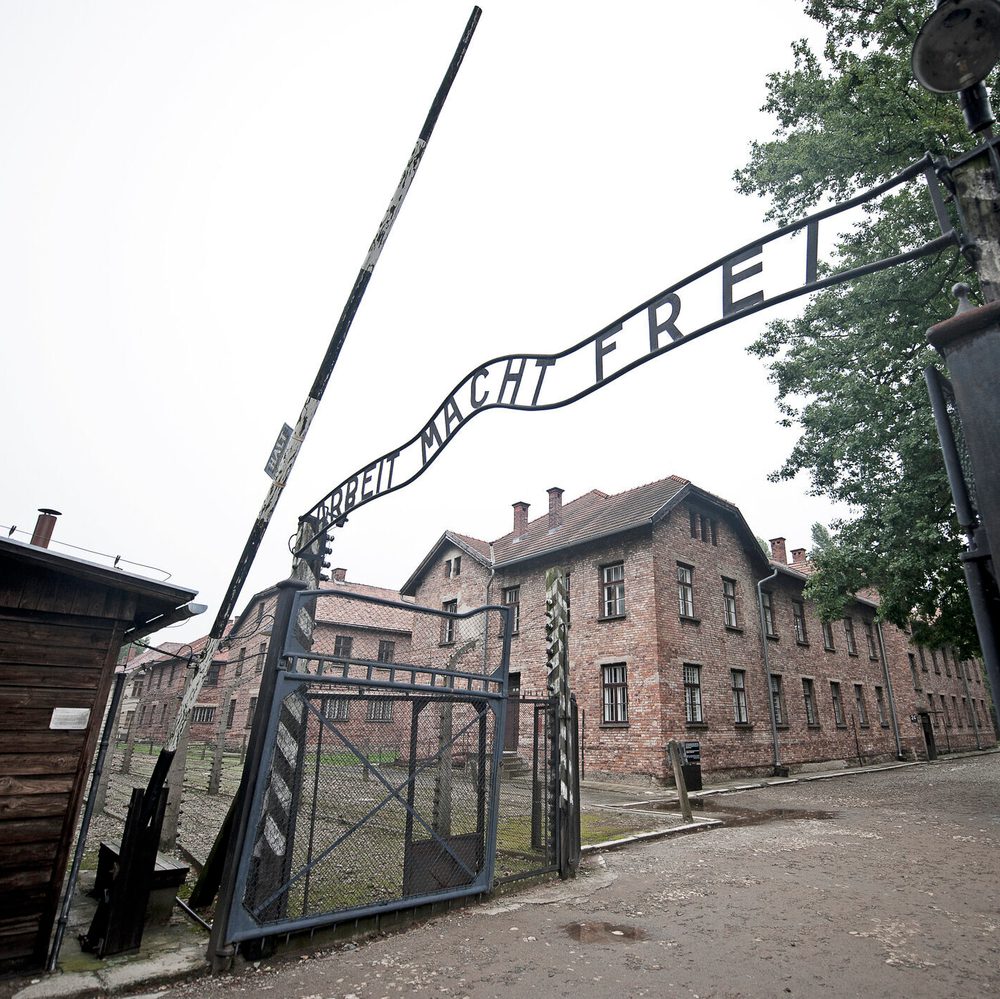 Arbeit Macht Frei entrance sign in perspective, Auschwitz-1, Krakow, Poland stock photo Alabama News