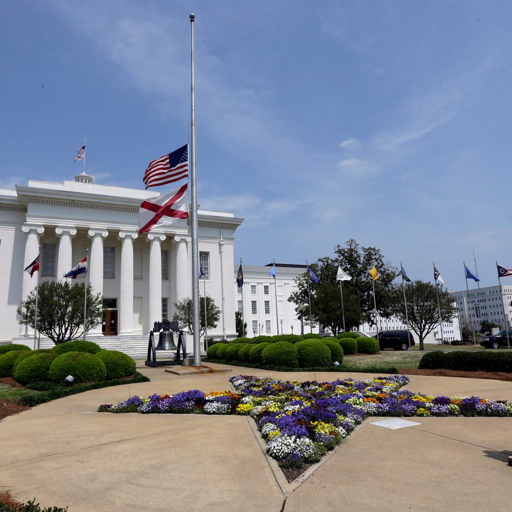 Flags fly at half staff outside the Alabama Capitol in Montgomery, Ala., Wednesday, April 17, 2013. Alabama Gov. Robert Bentley has ordered the flags at the Alabama Capitol to fly at half-staff in honor of those injured or killed in Monday's bombings at t Alabama News