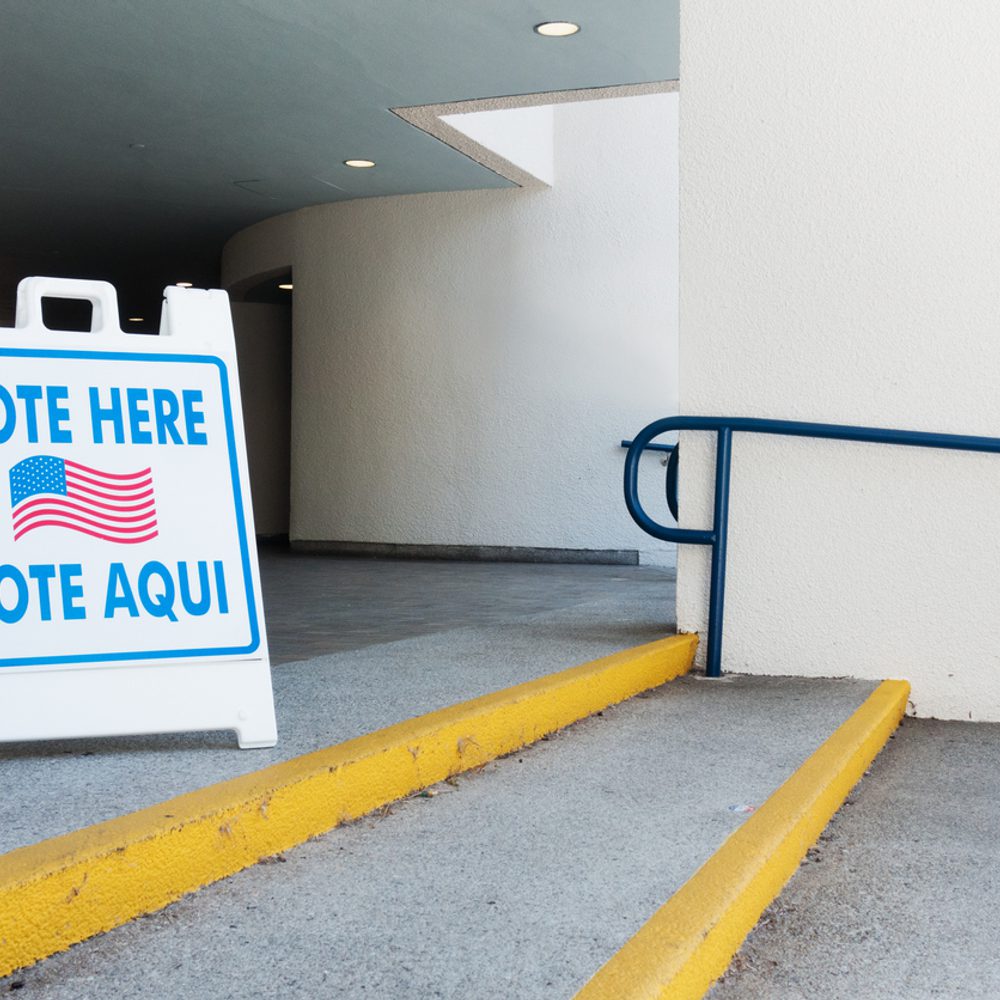 Vote here sign in English and Spanish at Polling Place stock photo Alabama News