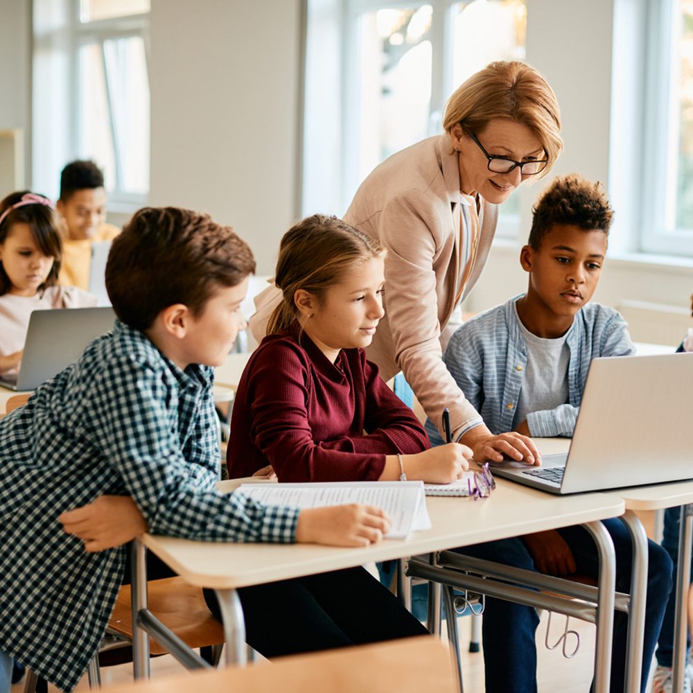 Elementary teacher and her students. Education. Alabama News