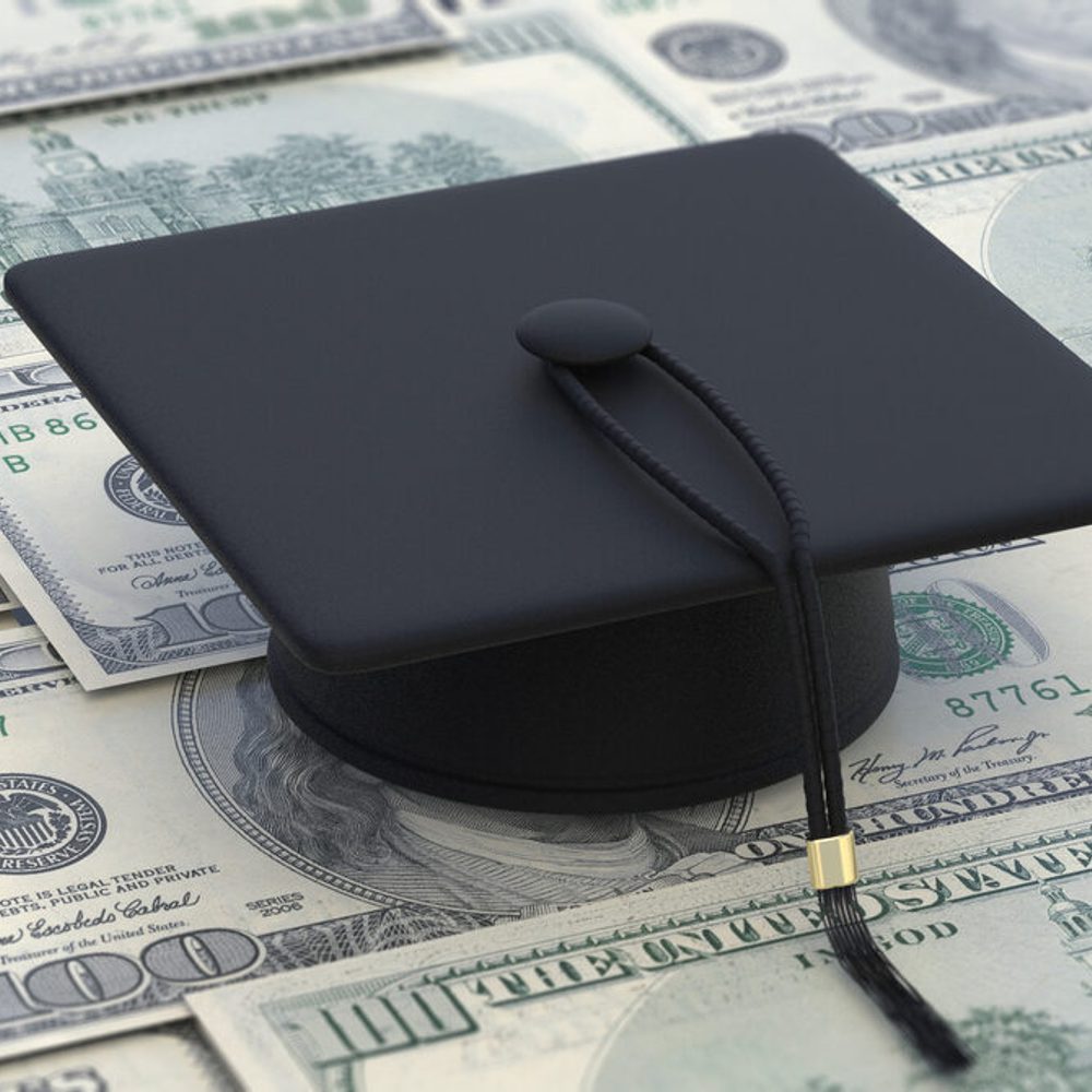 College cost, student loan, scholarship. Graduate cap on dollar banknotes. 3d illustration stock photo Alabama News