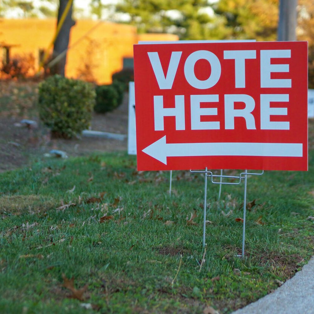 Vote here sign on election day stock photo Alabama News