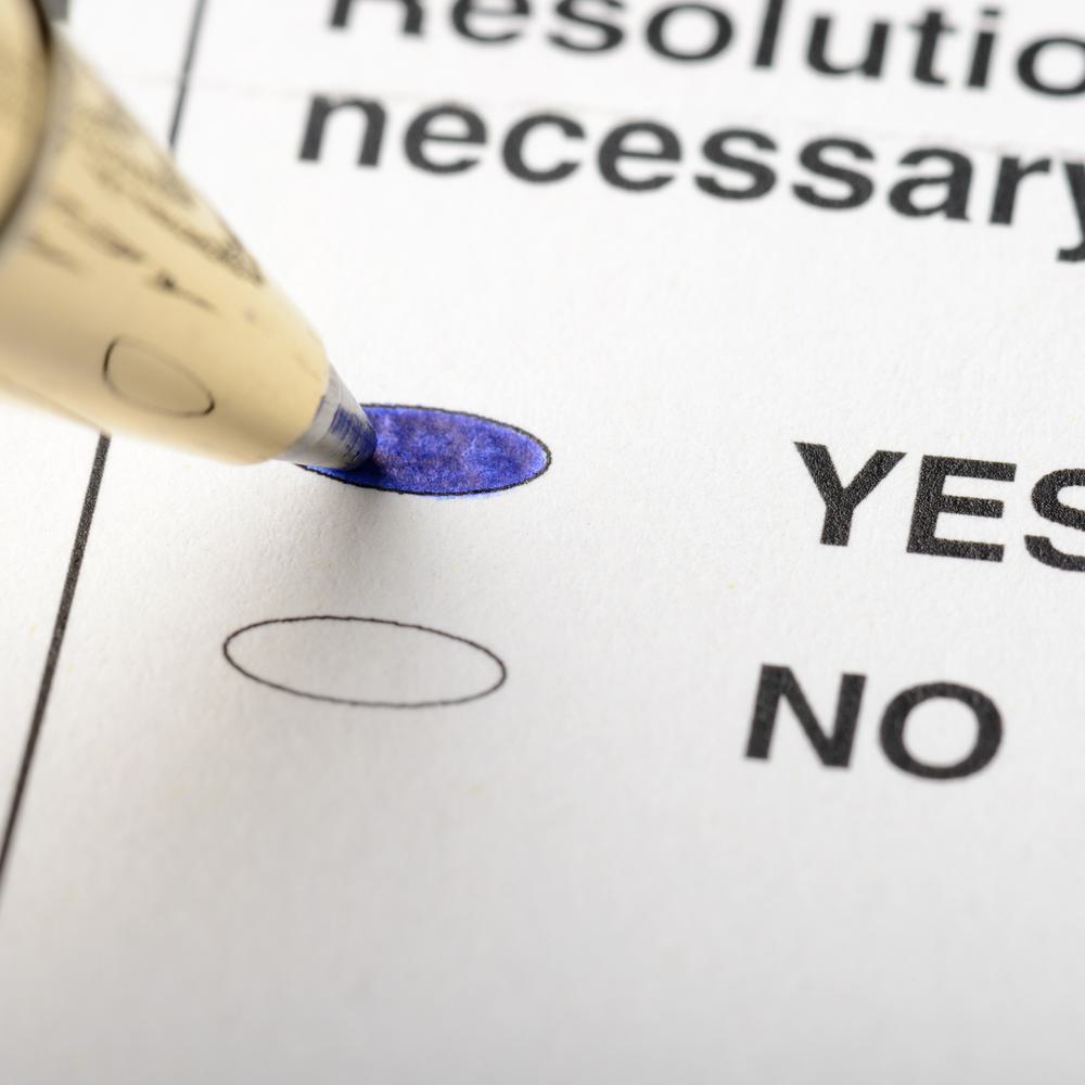 A close up of a pen filling in the yes option on a ballot. Alabama News