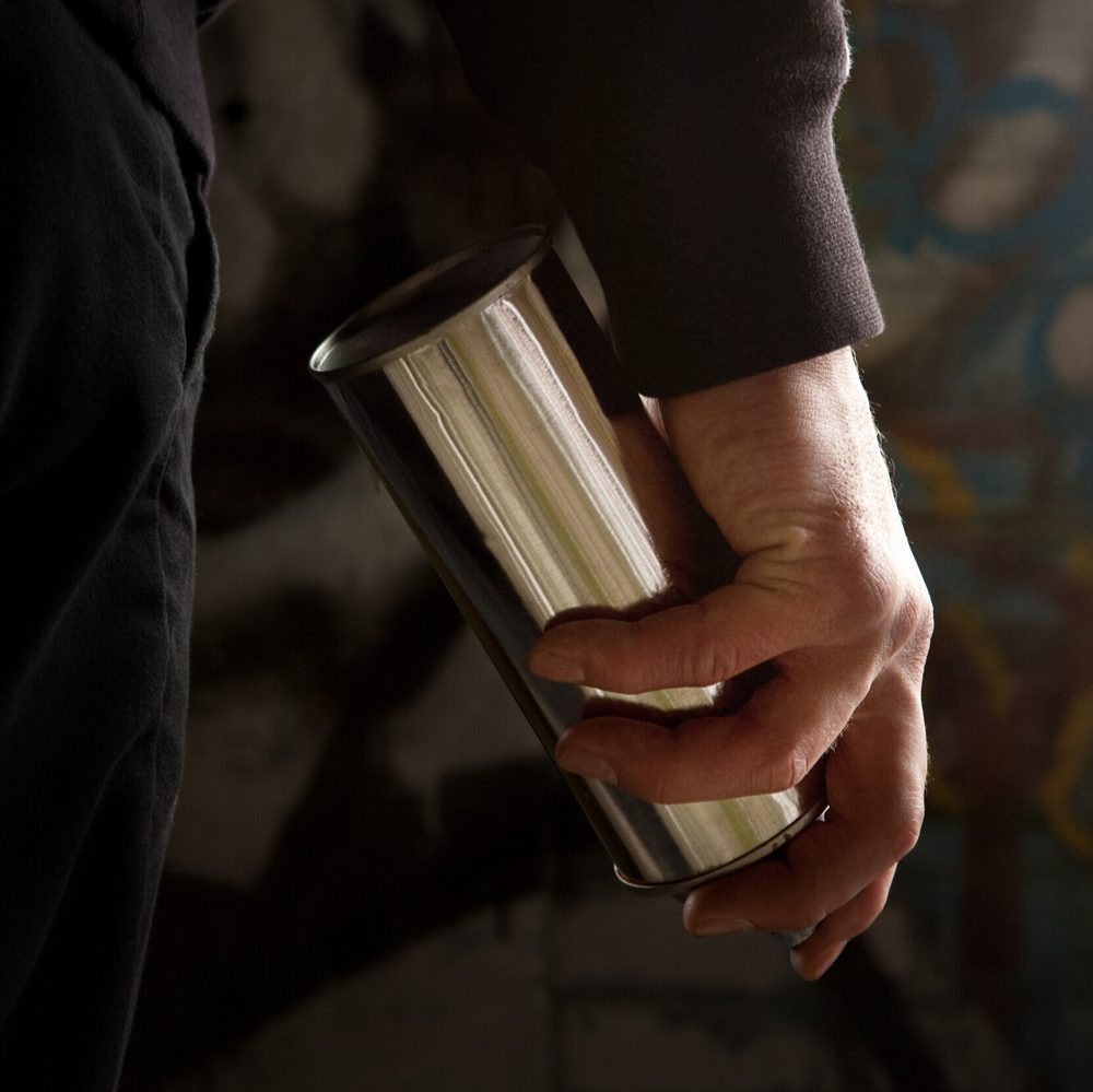 hand holding can of spray paint Alabama News
