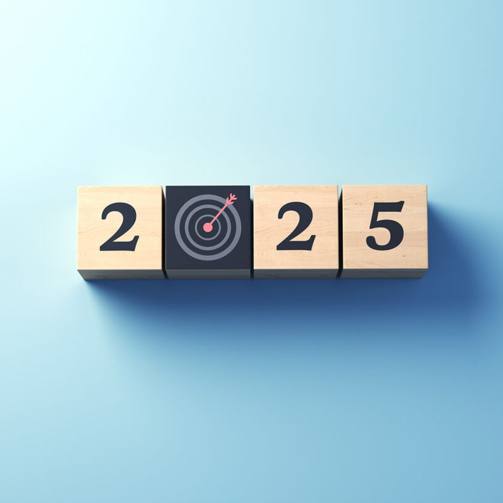 New Year 2025 And Symbol Hit From 12 On Black Dartboard Written On Wooden Block Sitting On Blue Background stock photo Alabama News