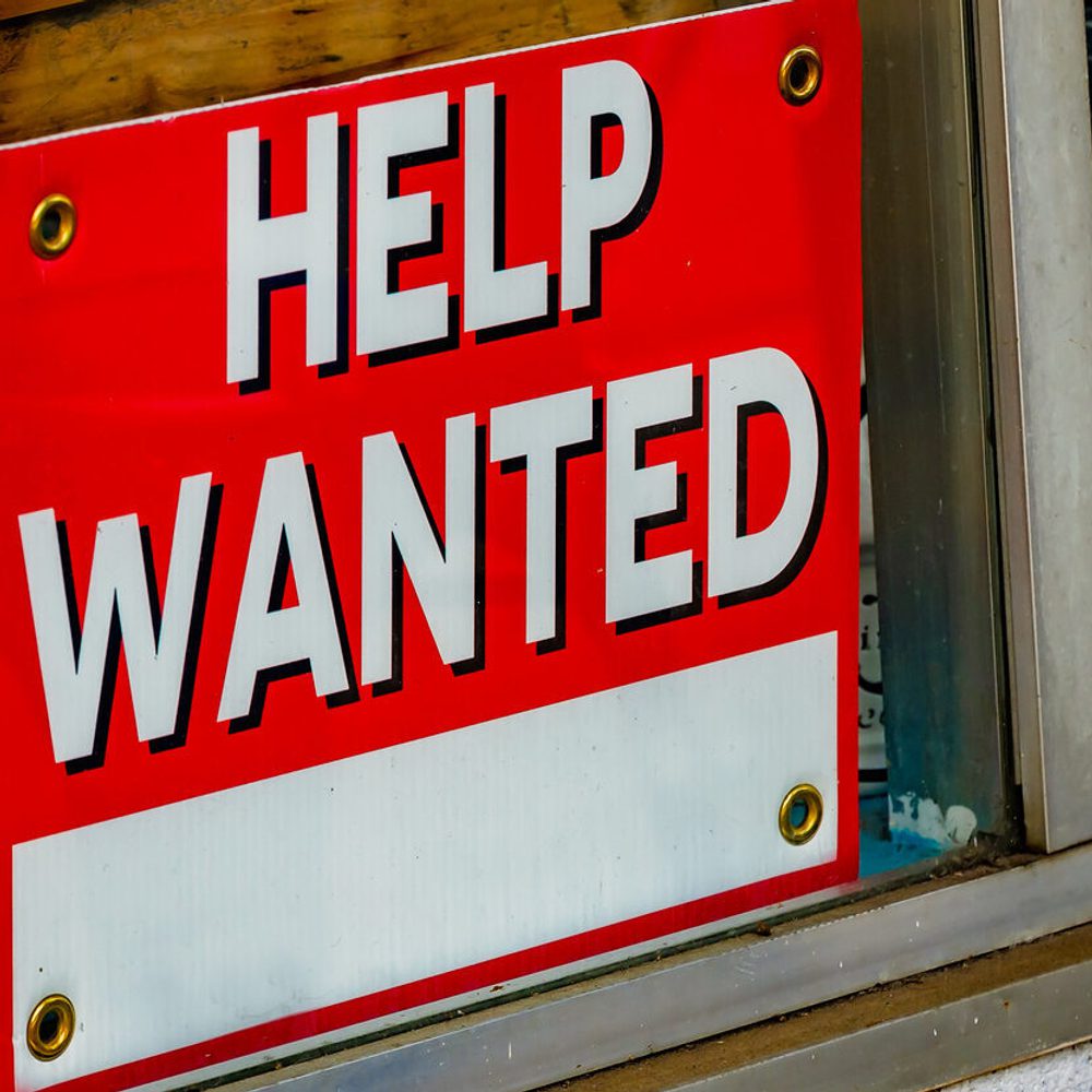 Help wanted sign in coffee shop window in Foley, Alabama stock photo Alabama News