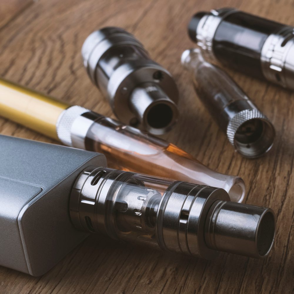 Vape pen, mod, e cigarette, e-cig, on a wooden background. stock photo Alabama News