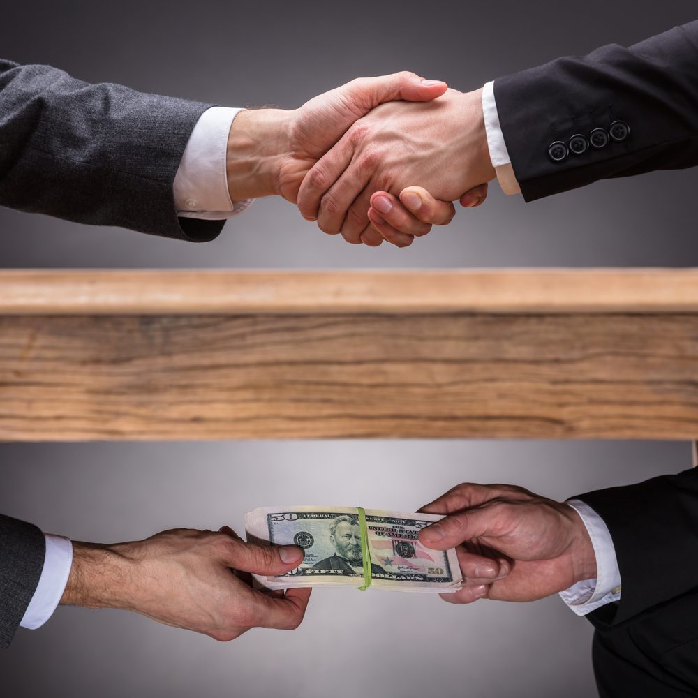 hands money under the table Alabama News