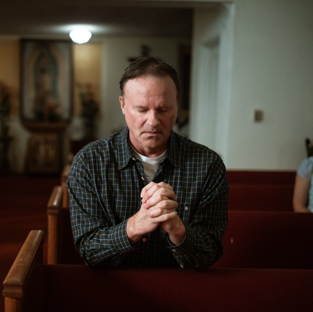 Man praying in church Alabama News