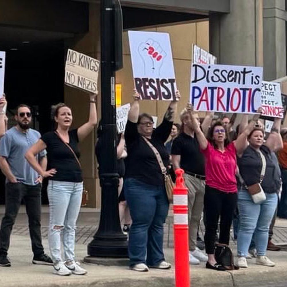 Protester outside Donald Trump, Jr. event, 4/3/2025 Alabama News